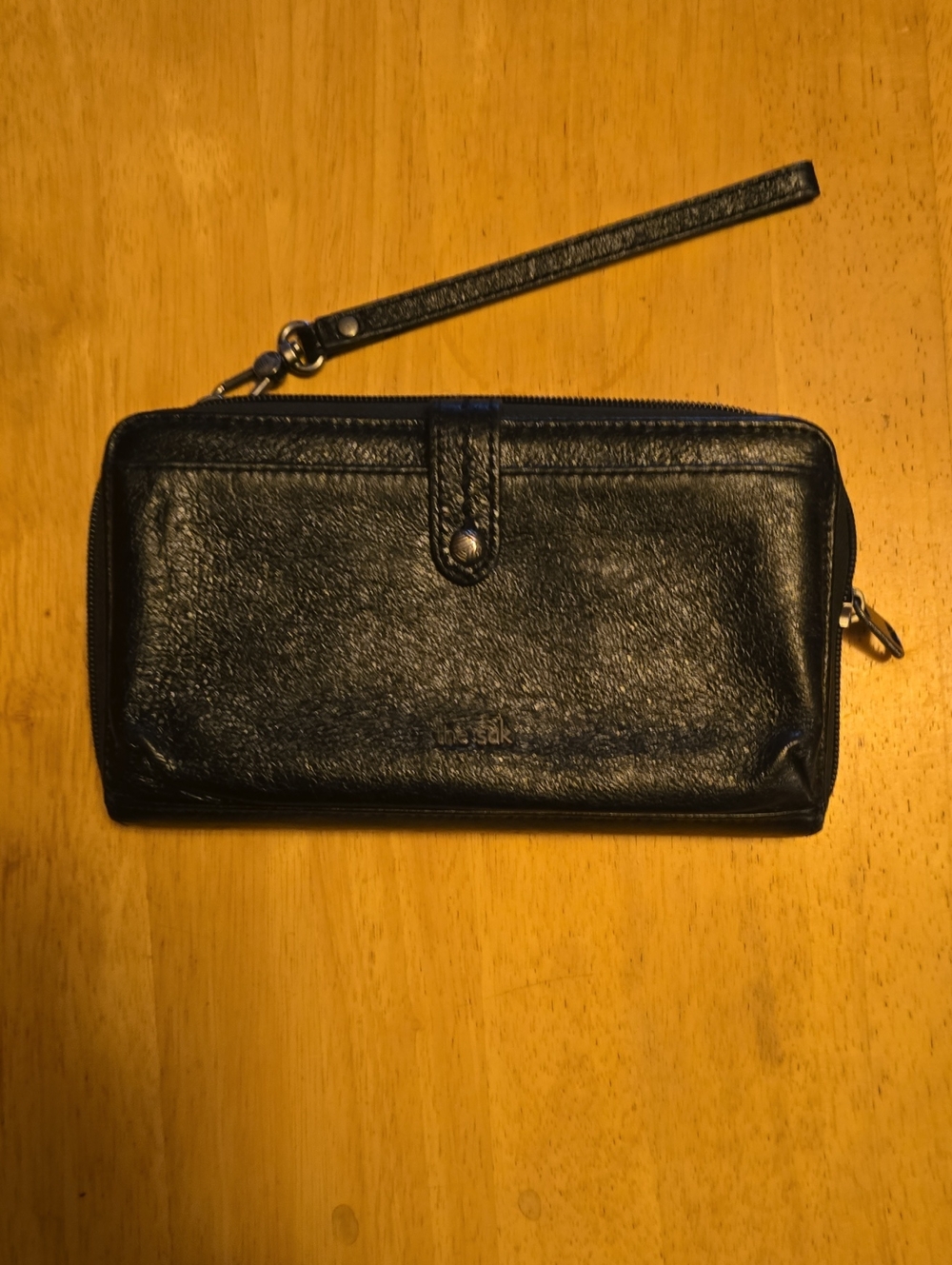 The Sak Black Leather Zip-Around Wristlet